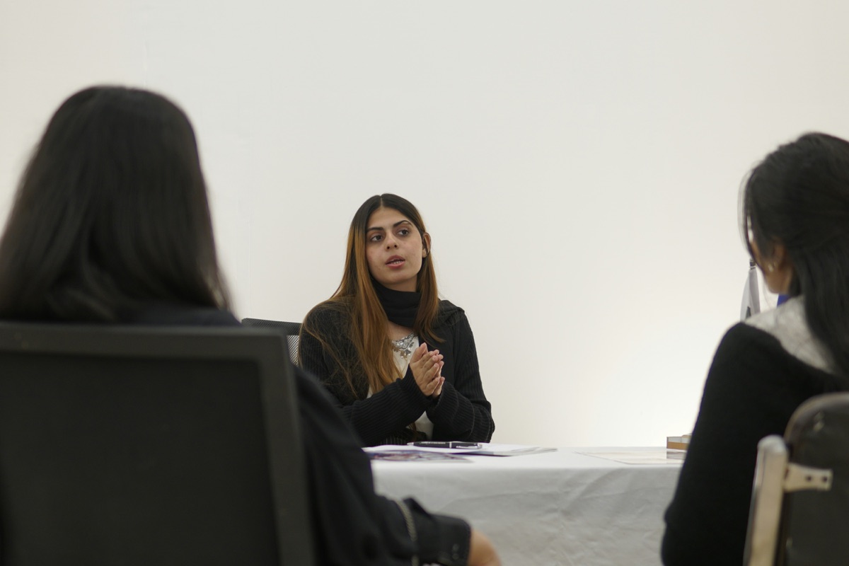 A young woman facilitating a workplace mental health training session