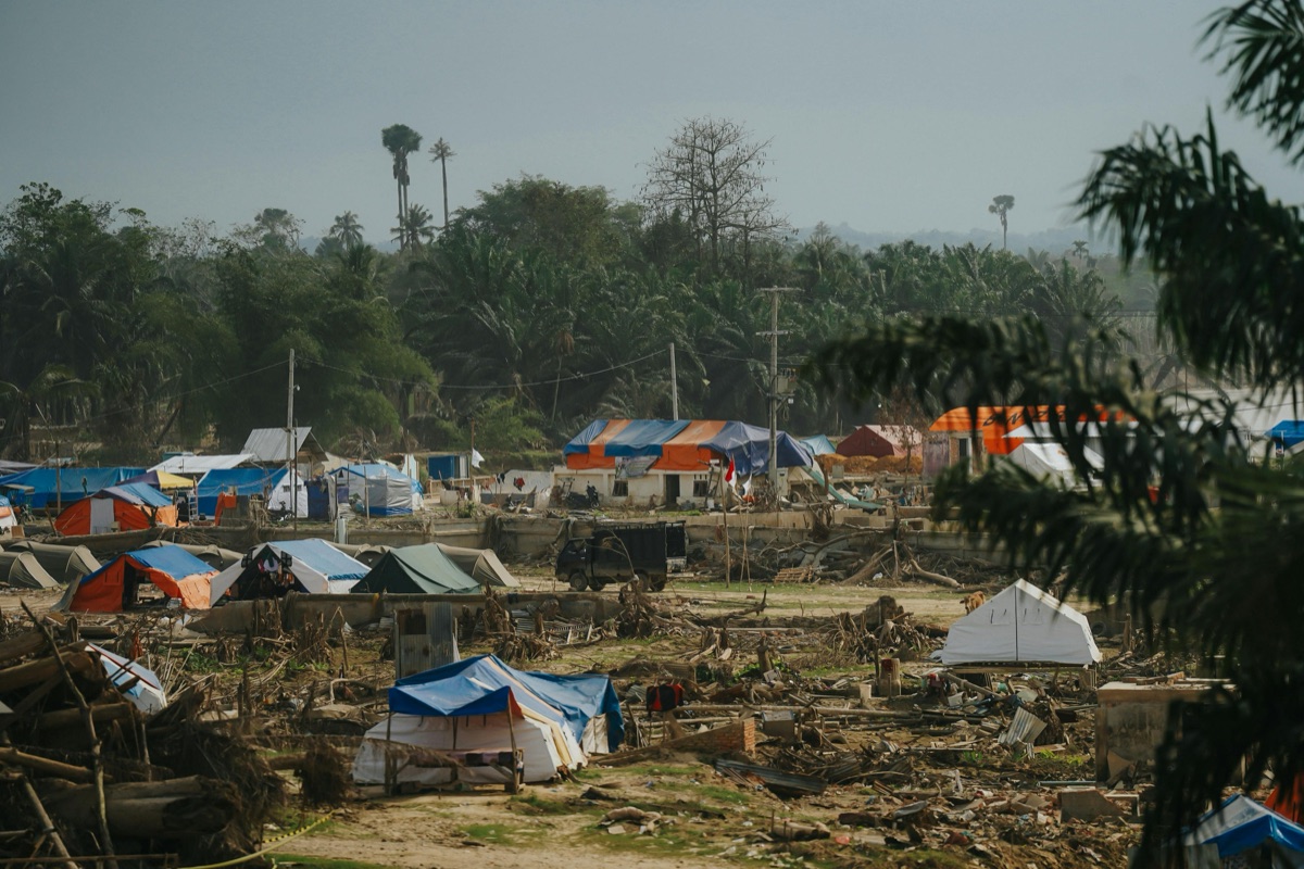 A displacement camp with shelter tents after a climate disaster